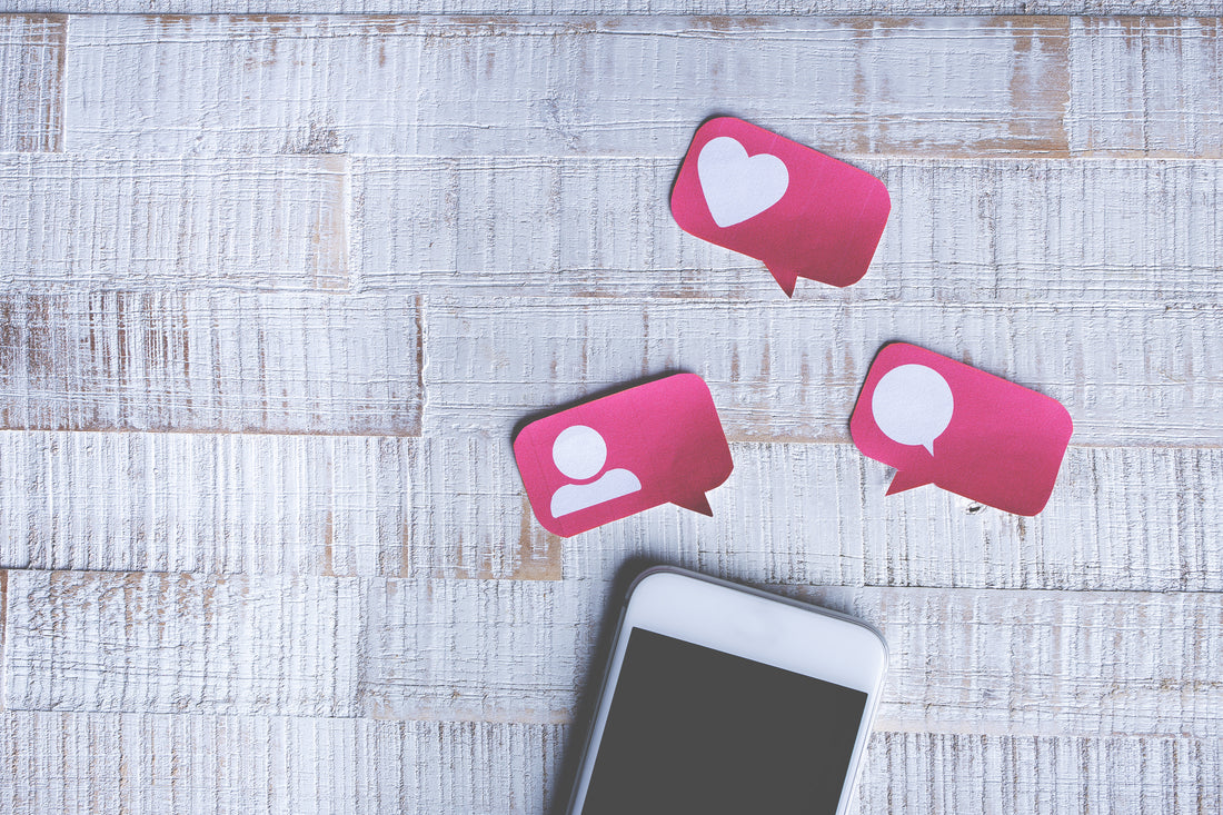 Mobile phone on table with social media stickers above it | Safe Sleep Space