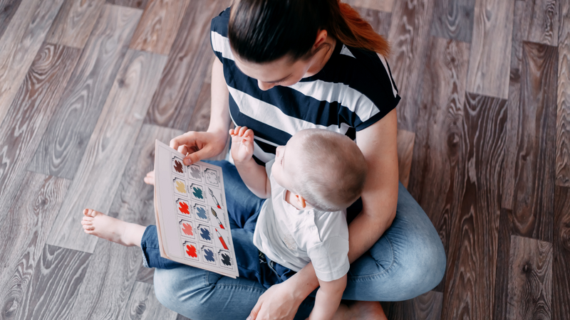 Mother reading to baby