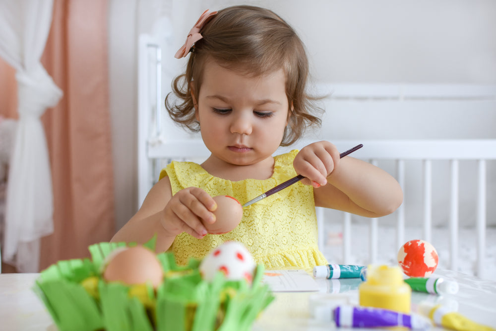 Toddler playing with paint